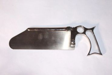 A uniquely designed hand saw with a metal handle and broad blade.