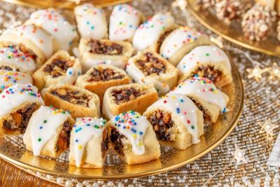 Plate of iced fig cookies with sprinkles.