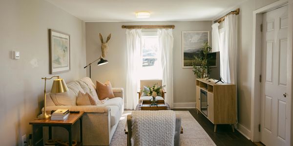 Cozy living room with neutral tones and natural light.