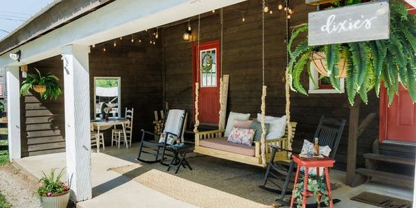 Cozy porch with swings and rocking chairs at Dixie’s.