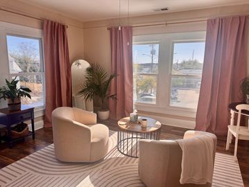 A room with  chairs  for virtual readings, merging modern spirituality with timeless wisdom.