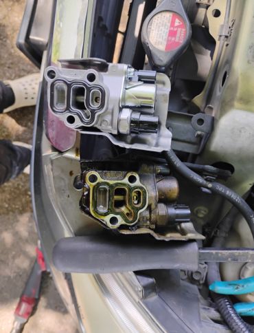 New vs old car engine parts on a vehicle.