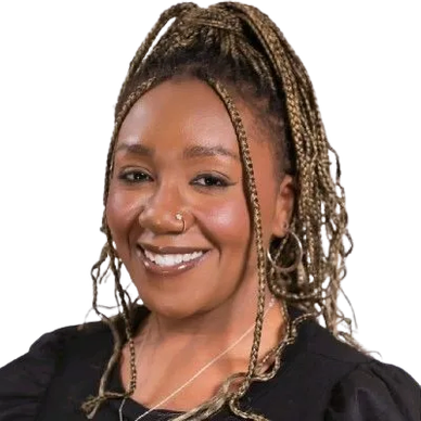 Smiling woman with braided hair and nose ring.