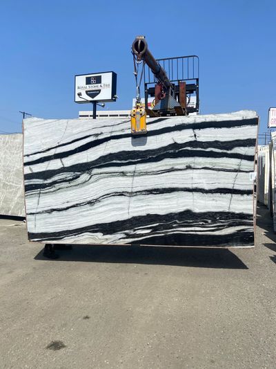 royal stone slab yard in los angeles with quartzite slabs of cristallo and panda black and white
