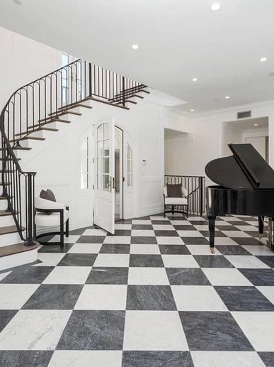 Checkerboard marble tile flooring in alternating white calacatta marble and grey bardigllio marble 