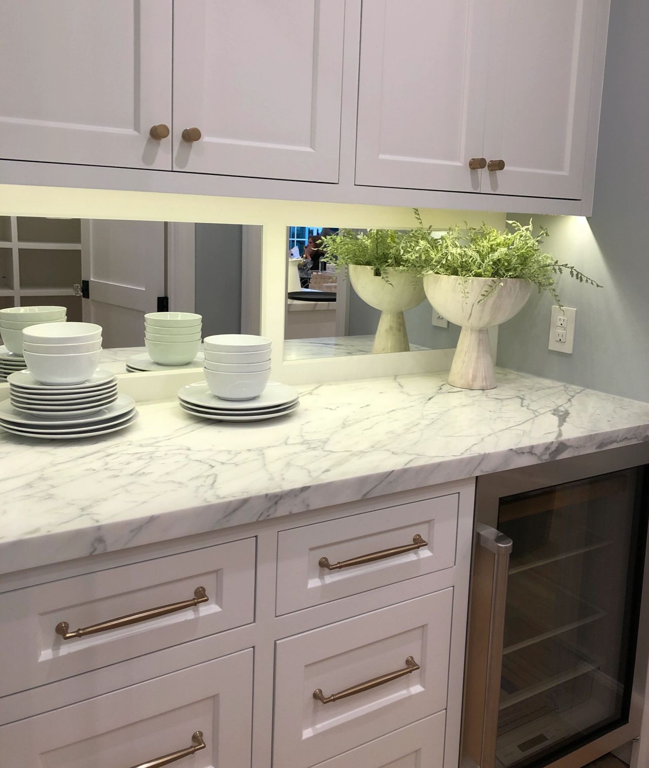 Statuary Vein Marble Honed Installed In Buffet With Mirror Splash