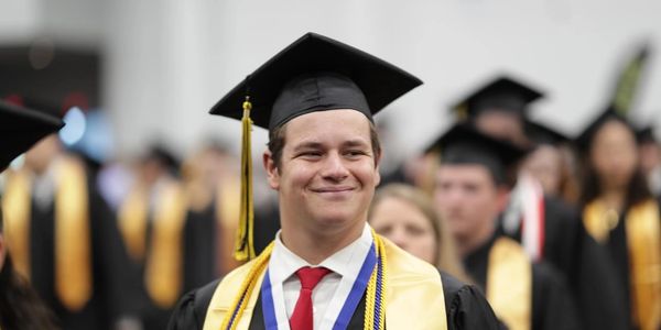 DJ Dees Smiling during his High School Graduation