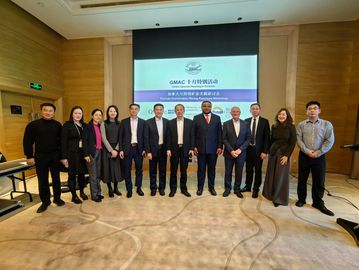 Group of professionals posing at a conference.