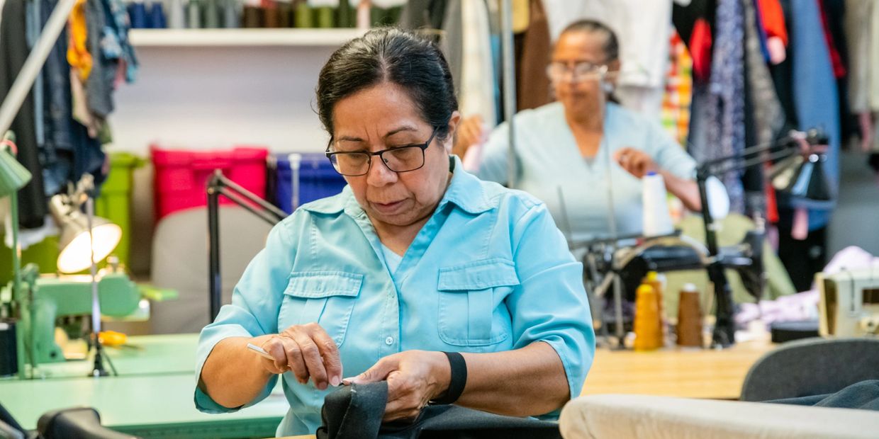 an elderly woman buy in her work 