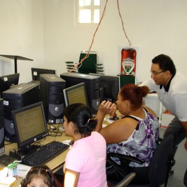 People working together on computers in an office setting.