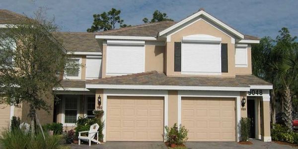 Second story home protected with rolling shutters