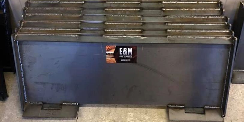 E&M Steel Products carries several skid steer attachments, including back plates and forks