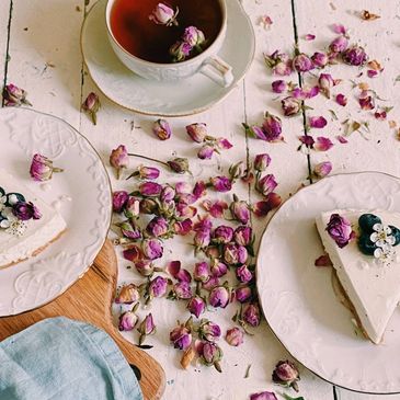 Dried rose buds and a cup of tea on the table