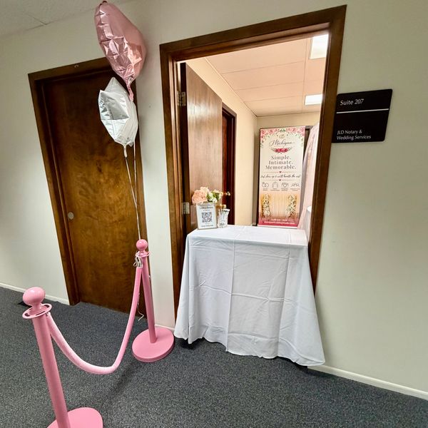 Welcoming wedding services suite decorated with balloons and flowers.