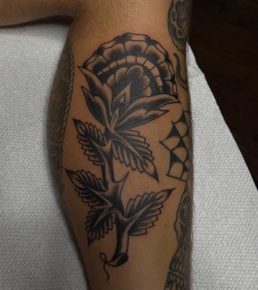 Black and grey floral flash tattoo done in Pensacola, Fl NAS 