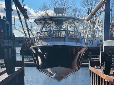 Boat on the lift at Gales Ferry Marina:  Plan ahead for the upcoming seasons