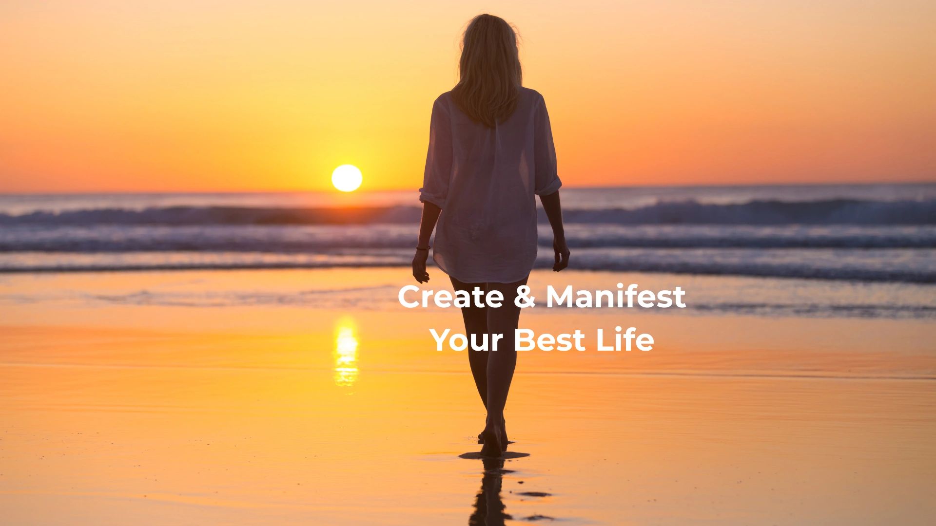 A woman walking on the beach while the sun sets. The sun is just above the horizon.