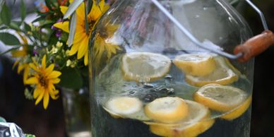 Lemon slices floating in a clear beverage jug.