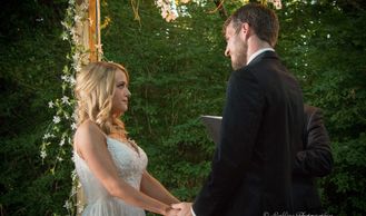 A bride and groom holding hands