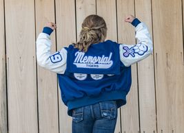 A portrait of a girl showing her sports jacket