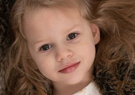 A portrait of a girl with light brown hair