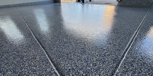 Smooth, polished epoxy floor with clean lines and reflective surface.
