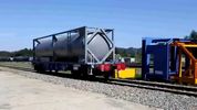 Tank container on railway flat