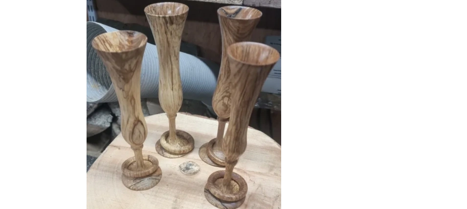 Champagne flutes with captive rings, turned from figured wood