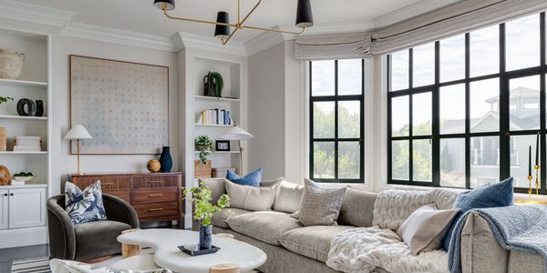 Cozy contemporary living room with plush seating and natural light.