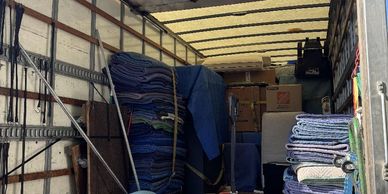Straps and blankets in the moving truck.