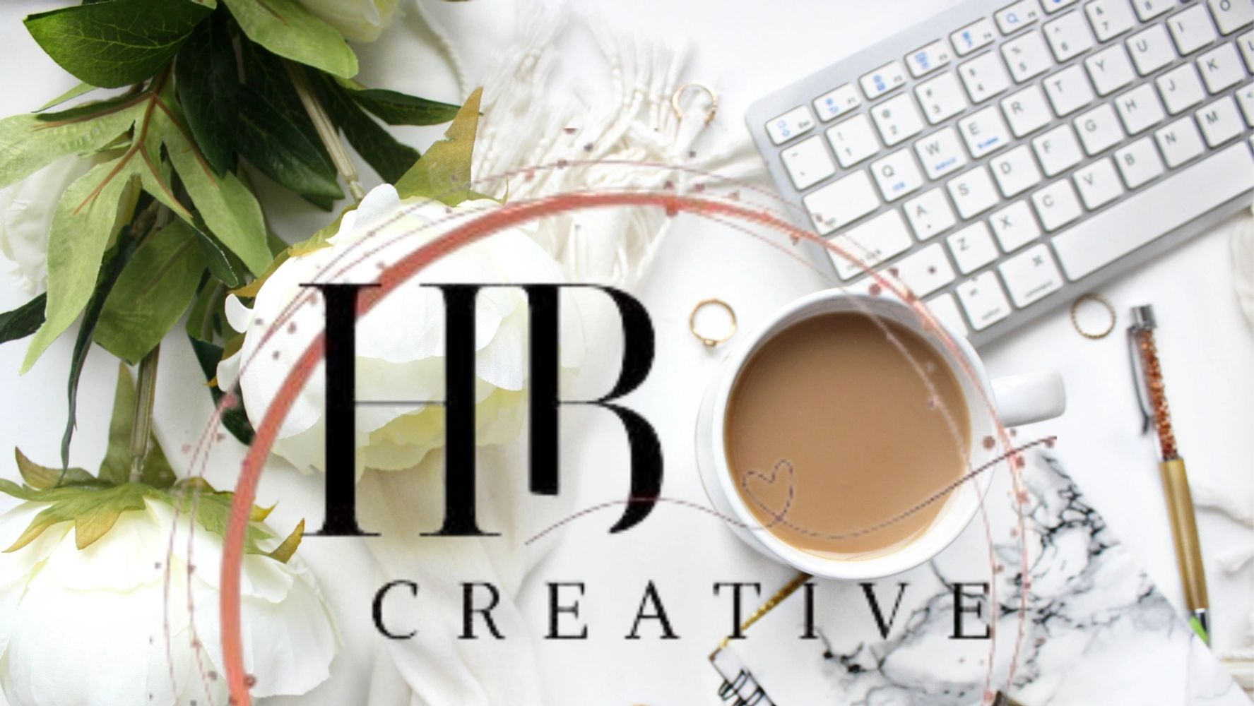 Flat lay of workspace with coffee, keyboard, flowers, and HR Creative logo overlay.