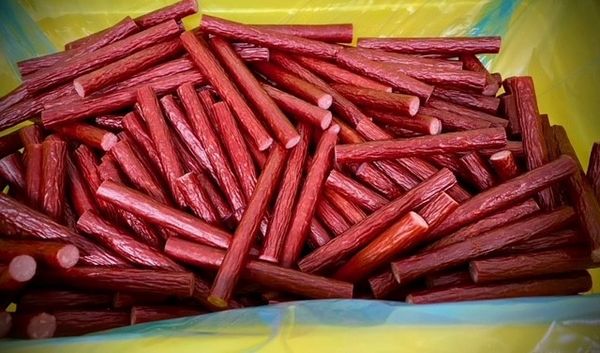 Pile of red meat sticks.