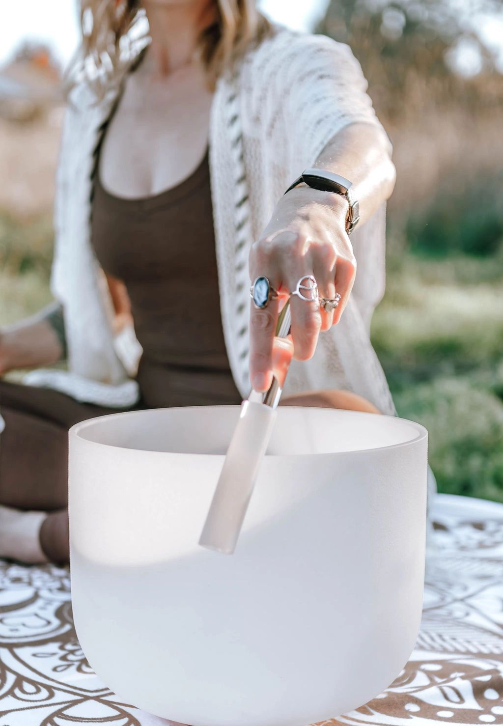 Melissa playing crystal singing bowls at Sacramento sound bath