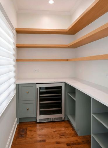 Pantry with floating shelves made of Rift White Oak and custom Crystal Cabinets in Green Haze!