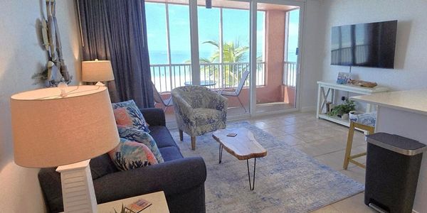 Cozy living room with ocean view and modern decor.