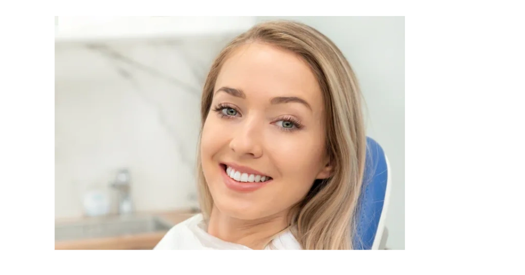 Smiling woman with blonde hair and bright teeth.