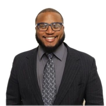 Smiling man in glasses and suit against a white background.