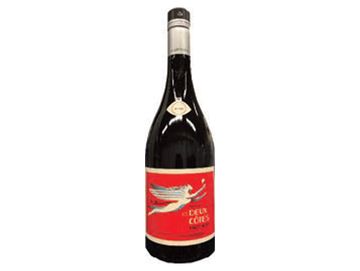 Red wine bottle with a red and white label.