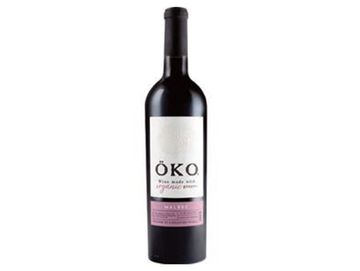 A bottle of Öko wine with a white and pink label.