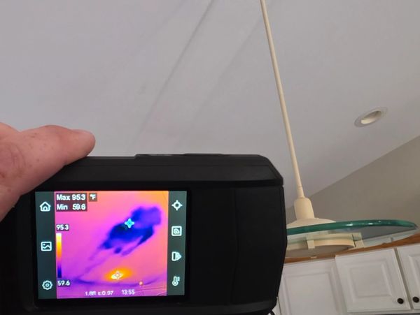 Thermal imaging identifying hidden moisture intrusion from a roof leak in an Eastern Iowa home