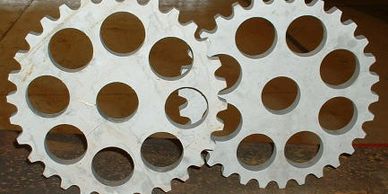 Custom made stainless steel sprockets. Waterjet cut from 5/8" steel for the Union Pacific RR.