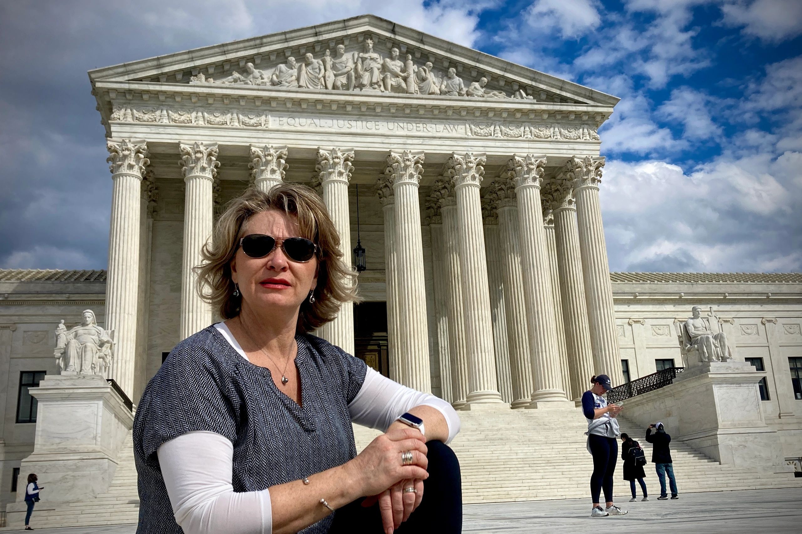 Landee in front of the United States Supreme Court in Washington, DC.