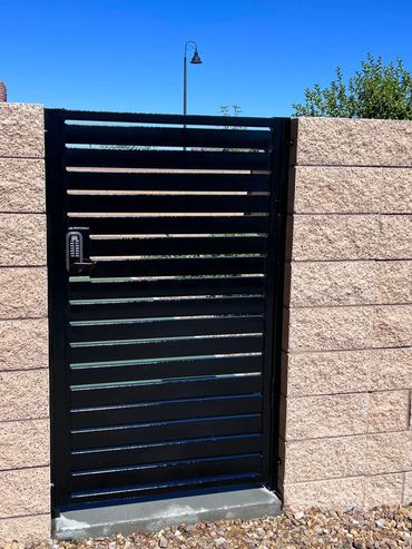 Modern wrought iron walk gate with a digital Lockey. Custom Fabricated. 100% USA Made. Henderson