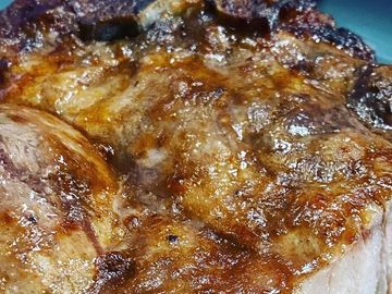 Close-up of a juicy grilled steak with a crispy sear.