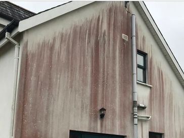 Stained render needing to be cleaned 