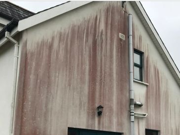 Stained render needing to be cleaned 