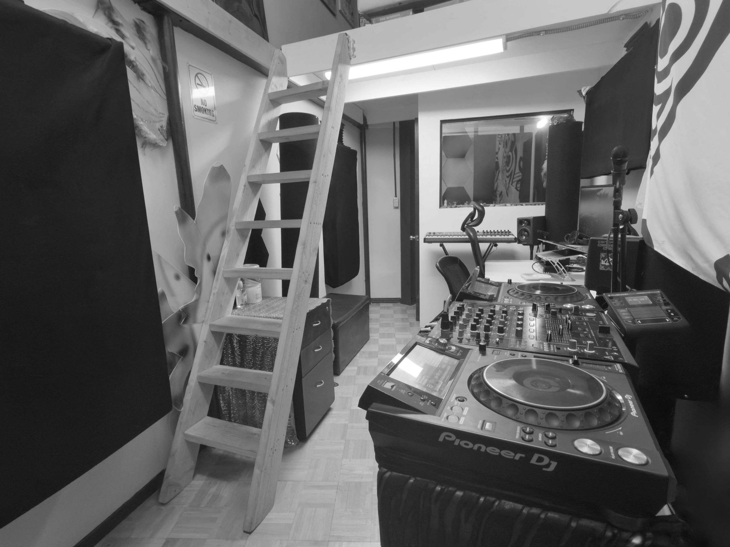 DJ setup with Pioneer controller under loft in Burbank recording studio