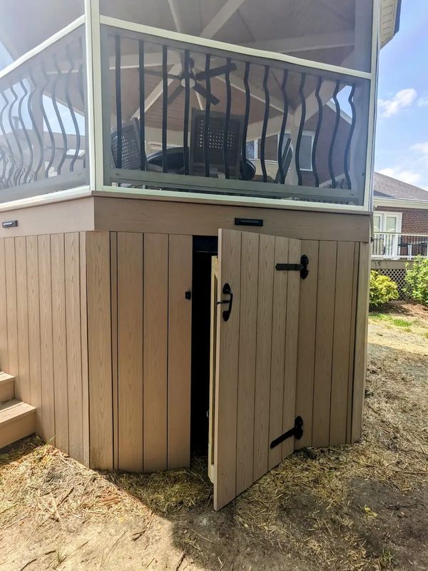 Gazebo crawl space access with custom door build from pvc deck boards. 