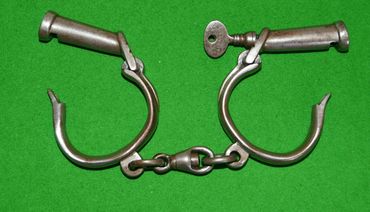 A good mid 19th century set of police handcuffs by Field & Sons