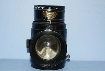 An antique police lamp with bulls eye lens, belt hook and carrying handles.
Victorian Dolan & co Lon